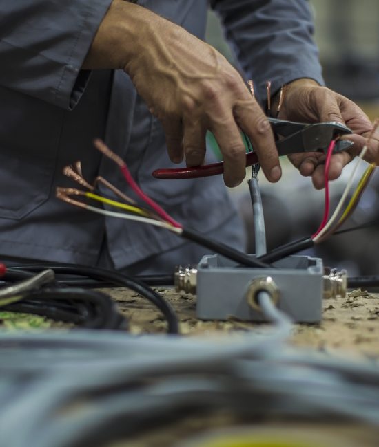 Close-up of mechanics hands in workshop